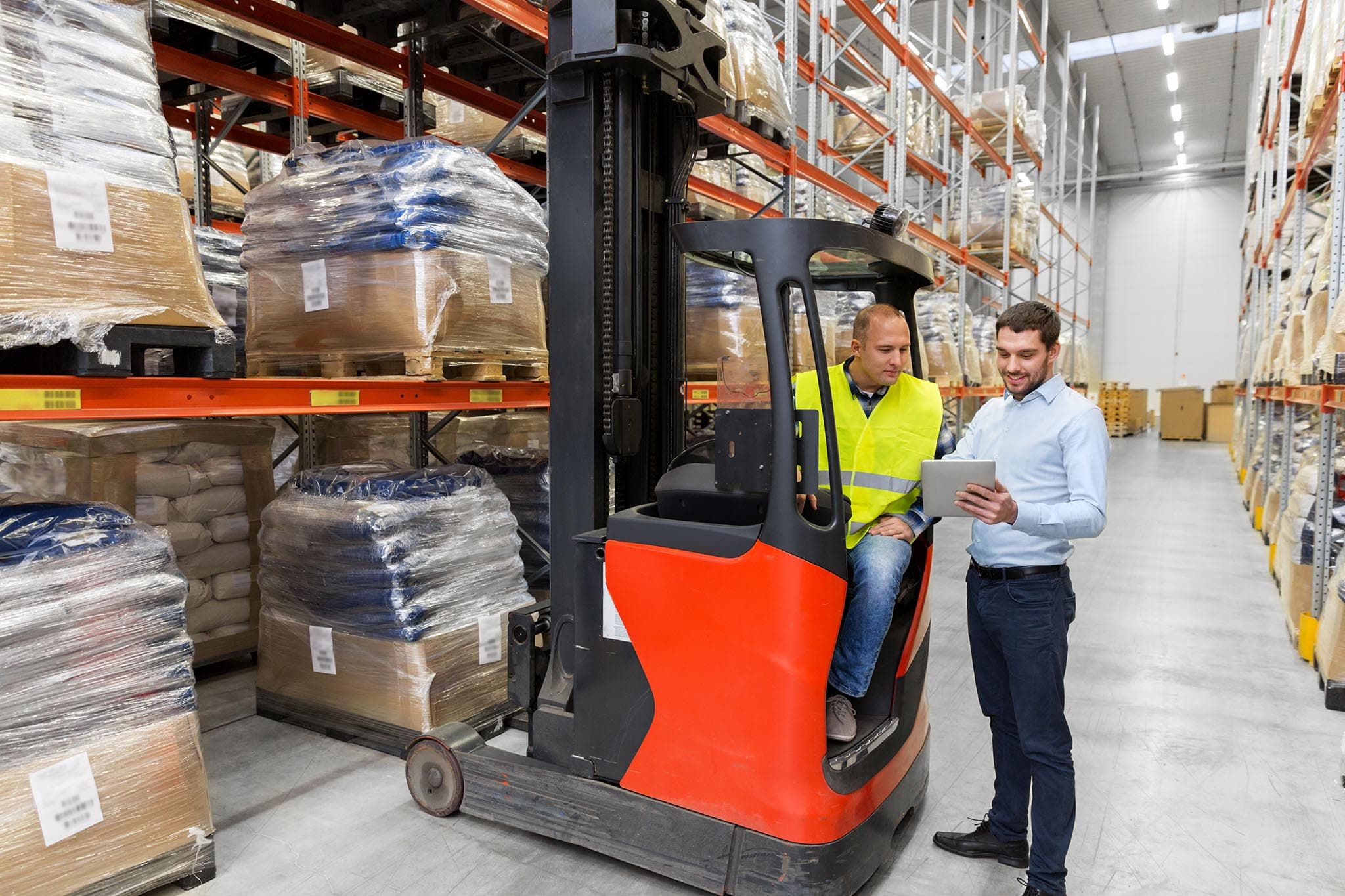 Freight professional coordinating cargo inside a logistics facility